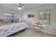 Charming bedroom with a ceiling fan, window and vanity table at 2307 Valencia Dr, Sarasota, FL 34239