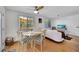 Bright dining area with glass table and windows for ample natural light and outside view at 2307 Valencia Dr, Sarasota, FL 34239