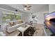 Inviting living room with a cozy sofa, decorative accents, and a large window at 2307 Valencia Dr, Sarasota, FL 34239