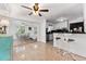Bright, open living area showcasing terrazzo floors, dining space, and kitchen at 2307 Valencia Dr, Sarasota, FL 34239
