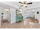 Bright living space with dining area, vintage terrazzo flooring, and open floor plan at 2307 Valencia Dr, Sarasota, FL 34239