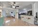 Kitchen with white cabinets, black countertops, stainless appliances, and stylish black-and-white patterned flooring at 2307 Valencia Dr, Sarasota, FL 34239
