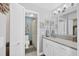 Clean bathroom with white cabinets, neutral countertops, and a shower/tub combo with a patterned shower curtain at 308 Timber Lake Dr, Bradenton, FL 34210