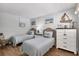 Charming bedroom with two twin beds, nautical decor, and wicker accents for a cozy, coastal feel at 308 Timber Lake Dr, Bradenton, FL 34210