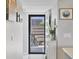 Charming foyer featuring tile flooring and view of a private courtyard through screen door at 308 Timber Lake Dr, Bradenton, FL 34210