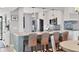 Bright kitchen featuring a breakfast bar with seating and pendant lighting at 308 Timber Lake Dr, Bradenton, FL 34210