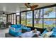 Inviting lanai featuring comfortable seating and scenic views of the lush landscaping and tranquil lake at 308 Timber Lake Dr, Bradenton, FL 34210