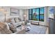 Comfortable living room with large window showcasing a scenic view of the lake at 308 Timber Lake Dr, Bradenton, FL 34210