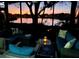 Cozy screened-in patio with comfortable seating and serene views of the lake at sunset at 308 Timber Lake Dr, Bradenton, FL 34210