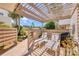 Cozy patio with lounge chairs and a grill, perfect for outdoor relaxation and entertaining at 308 Timber Lake Dr, Bradenton, FL 34210
