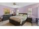 Traditional style bedroom with two large windows and furniture at 3108 River Woods Dr, Parrish, FL 34219