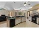 Eat in kitchen with a full set of appliances and a double sink with bright overhead lighting at 3108 River Woods Dr, Parrish, FL 34219