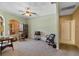 Inviting room with comfortable seating, carpeted floors, and views to an outdoor patio at 3108 River Woods Dr, Parrish, FL 34219