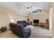 Cozy living room with vaulted ceiling, a triangular window, and comfortable seating arrangements at 3108 River Woods Dr, Parrish, FL 34219