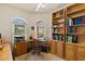 Charming office featuring built-in bookcases and natural light at 3108 River Woods Dr, Parrish, FL 34219
