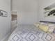 Well-lit bedroom features a comfortable bed, neutral walls, and an open doorway leading to another part of the house at 3248 Mangrove Point Dr, Ruskin, FL 33570