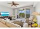 Comfortable living room with balcony access and serene water views at 3248 Mangrove Point Dr, Ruskin, FL 33570