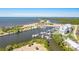 A scenic marina is surrounded by lush greenery and charming waterfront properties, offering a tranquil coastal experience at 3248 Mangrove Point Dr, Ruskin, FL 33570