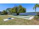 Outdoor shuffleboard courts surrounded by lush greenery and waterfront views at 3248 Mangrove Point Dr, Ruskin, FL 33570