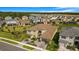 Aerial view of a two-story home with a tile roof and lush green landscaping in a friendly neighborhood at 3375 Juniper Springs St, Wesley Chapel, FL 33543