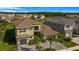 Beautiful two-story home with a tile roof, a manicured lawn, and a paved driveway at 3375 Juniper Springs St, Wesley Chapel, FL 33543