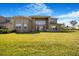 The backyard features ample green space and a view of the expansive lawn at 3375 Juniper Springs St, Wesley Chapel, FL 33543