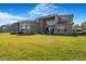 The backyard offers a generous green space and expansive lawn at 3375 Juniper Springs St, Wesley Chapel, FL 33543