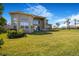 Lush green space of the backyard features ample space on an expansive lawn at 3375 Juniper Springs St, Wesley Chapel, FL 33543