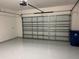 Clean garage with epoxy floors and an automatic door at 3375 Juniper Springs St, Wesley Chapel, FL 33543