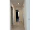 Hallway with tile flooring and doors leading to other rooms at 3375 Juniper Springs St, Wesley Chapel, FL 33543
