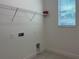 Laundry room with connections and shelving at 3375 Juniper Springs St, Wesley Chapel, FL 33543