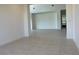 Spacious living room with neutral paint and tile floors with an open floor plan at 3375 Juniper Springs St, Wesley Chapel, FL 33543