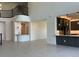 Bright living area with staircase, tile floors, and open layout, perfect for entertaining and Gathering gatherings at 3375 Juniper Springs St, Wesley Chapel, FL 33543