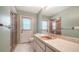 Bathroom featuring a single sink vanity, shower with glass door, and good lighting at 3572 Ferndell, Sarasota, FL 34235
