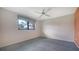 Cozy bedroom with plush carpet and a ceiling fan for added comfort at 3572 Ferndell, Sarasota, FL 34235