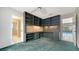 Well-organized home office with custom built-in shelving and pool view at 3572 Ferndell, Sarasota, FL 34235