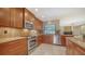 Modern kitchen with stainless steel appliances, granite countertops, and custom wood cabinetry at 3572 Ferndell, Sarasota, FL 34235