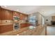Stylish kitchen with modern appliances, granite countertops, and a seamless flow into the living area at 3572 Ferndell, Sarasota, FL 34235