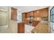 Well-appointed kitchen featuring custom wood cabinetry, stainless steel appliances, and granite countertops at 3572 Ferndell, Sarasota, FL 34235