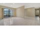 Bright, open living room with tile floors and a large window, offering ample natural light at 3572 Ferndell, Sarasota, FL 34235