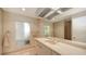 Bright bathroom featuring a marble countertop vanity, soft lighting, and a spacious layout for comfort and convenience at 360 N Washington Dr, Sarasota, FL 34236