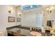 Well-lit bathroom features a large mirror, sleek vanity, and modern fixtures at 360 N Washington Dr, Sarasota, FL 34236
