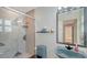 Modern bathroom with unique fixtures, including a stylish sink and shower with patterned tile accents at 360 N Washington Dr, Sarasota, FL 34236