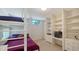Bedroom features bunk beds, built-in shelving, desk space, and natural light, perfect for or guests at 360 N Washington Dr, Sarasota, FL 34236