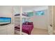 Cozy bedroom with bunk beds, a TV, and natural light, perfect for or guests at 360 N Washington Dr, Sarasota, FL 34236