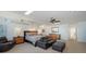 Spacious bedroom with neutral tones, ample natural light, and a comfortable seating area at 360 N Washington Dr, Sarasota, FL 34236