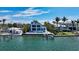 Stunning waterfront home boasting modern architecture, lush landscaping, and serene water views at 360 N Washington Dr, Sarasota, FL 34236