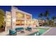 Exterior of a two story home featuring a pool, outdoor seating, and waterfront views at 360 N Washington Dr, Sarasota, FL 34236