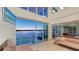 Bright living room with water views, tile floors, and modern furnishings at 360 N Washington Dr, Sarasota, FL 34236