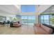 Bright living room with floor-to-ceiling windows showcasing waterfront vistas and stylish furnishings at 360 N Washington Dr, Sarasota, FL 34236
